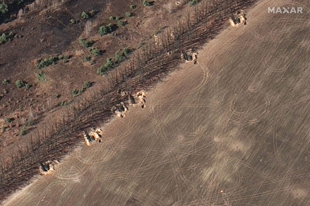 Protective berms are seen around Russian military equipment near Ozera on March 17.